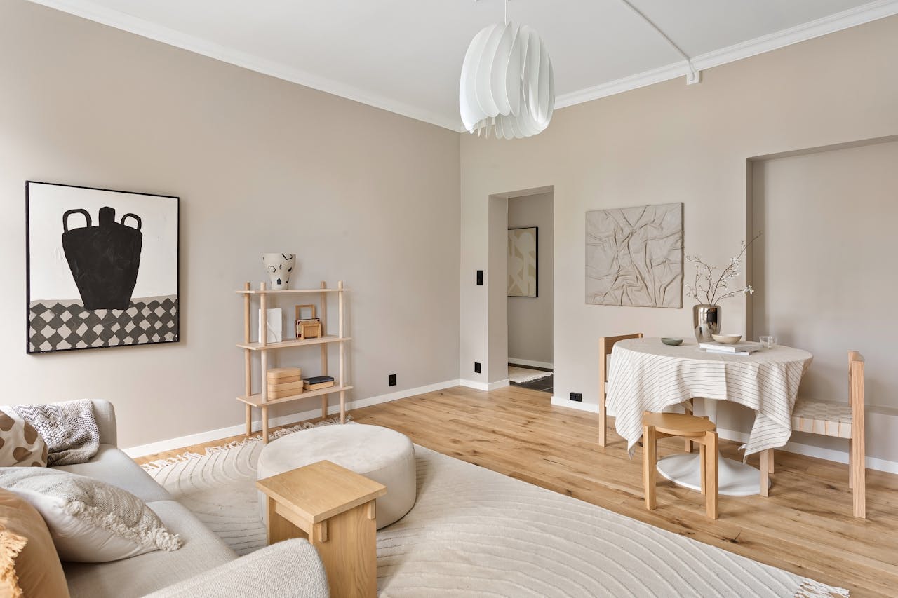 Stylish modern beige living room featuring minimalist decor and elegant furnishings.